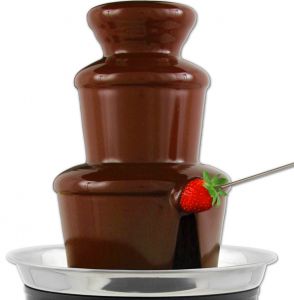 Milk Chocolate fountain with sliced fruits and Marshmallows